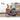 Woman exercises with a foam roller on a yoga mat in a living room.