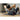 Person exercises on a foam roller to relieve muscle tension in a home gym setting.
