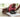 Man stretches with foam roller on yoga mat at home during exercise session