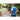 Man stretches his torso with a body roller on a park trail during daytime